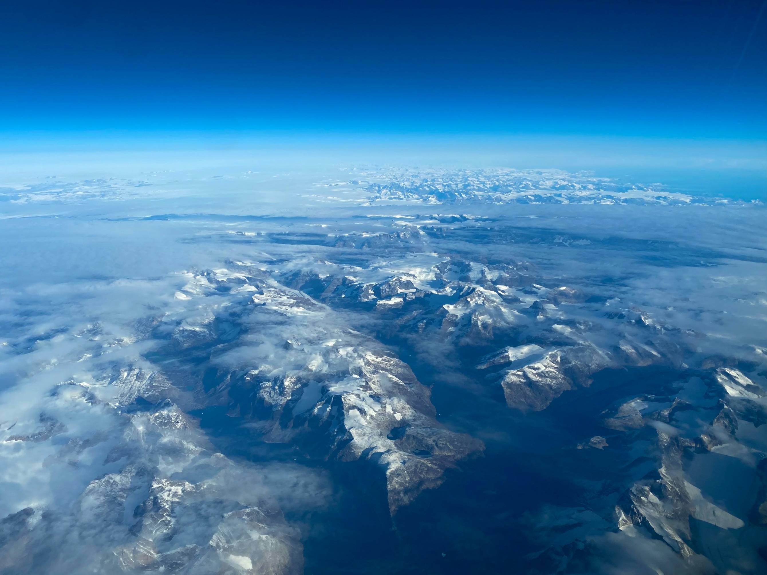 a view of a mountain range from an airplane