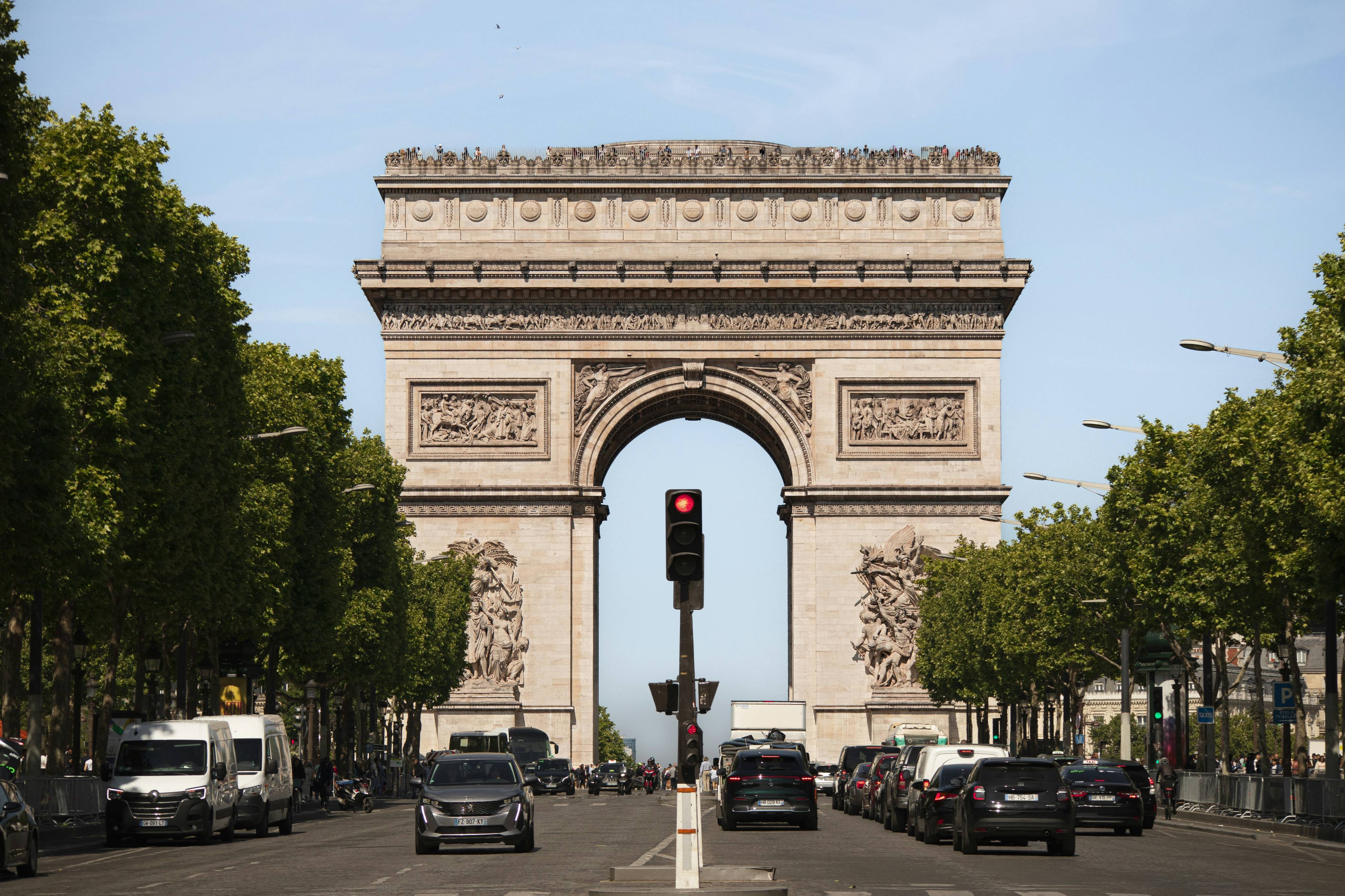 The arc de triomphe stands tall in paris.