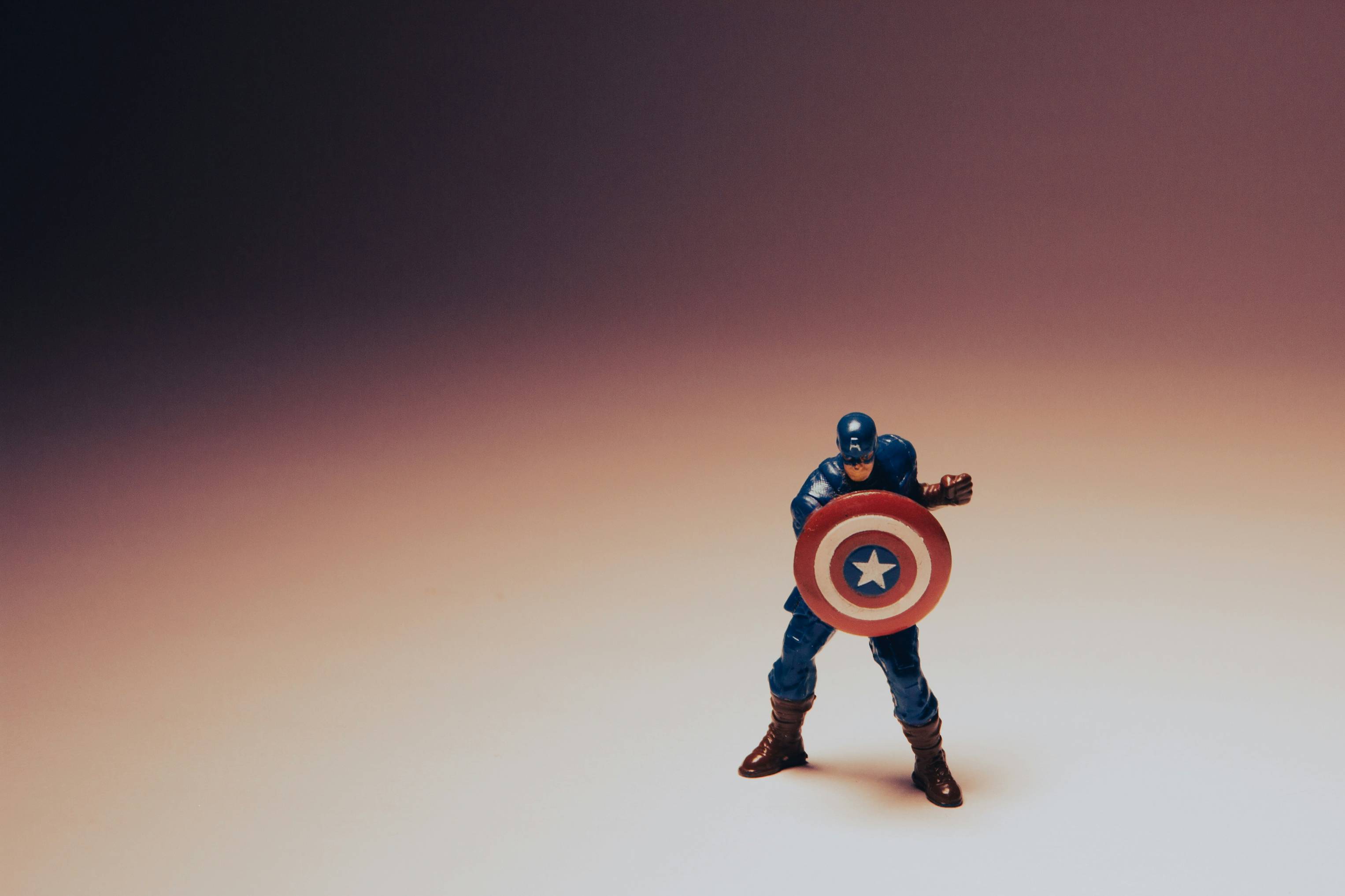a toy of a captain america holding a shield