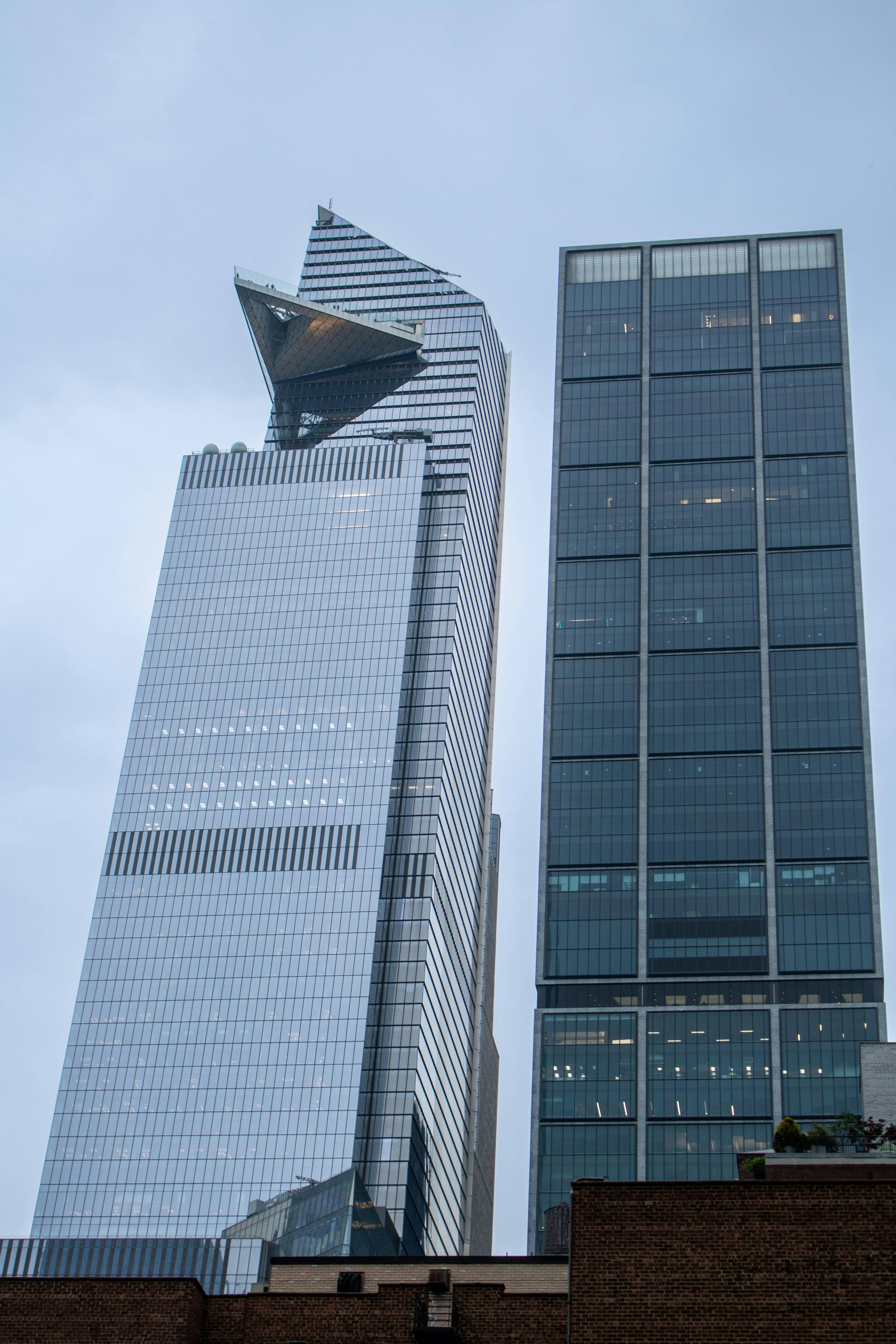 Two tall buildings are next to each other